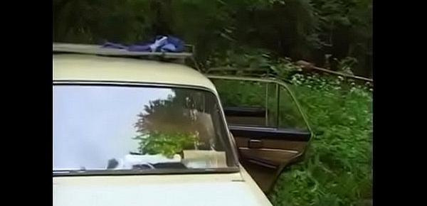  Russian couple is fucked by car in the woods